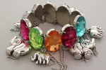 Rhodium Casting Chunky Stretchable Charm Bracelet with Multi Colored Acrylic Stones and Elephant Charms. Bracelet Is 2.95 Thick. Nickel and Lead Compliant.
