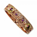 Genuine 1928 Boutique (TM) Bracelet. Rose-tone Dark Purple Crystal/Floral Decal Stretch Bracelet. 100% Satisfaction Guaranteed.