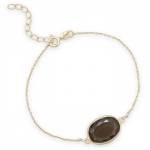 7 + 1 extension 14 karat gold plated sterling silver bracelet with faceted smoky quartz. The size and shape of the stone will vary. The approximate size of the stone will be 13mm x 16.5mm. This bracelet has a spring ring closure.