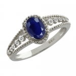 1.18 Ct 7x5mm Oval Blue Sapphire and White Topaz 18K White Gold Ring
